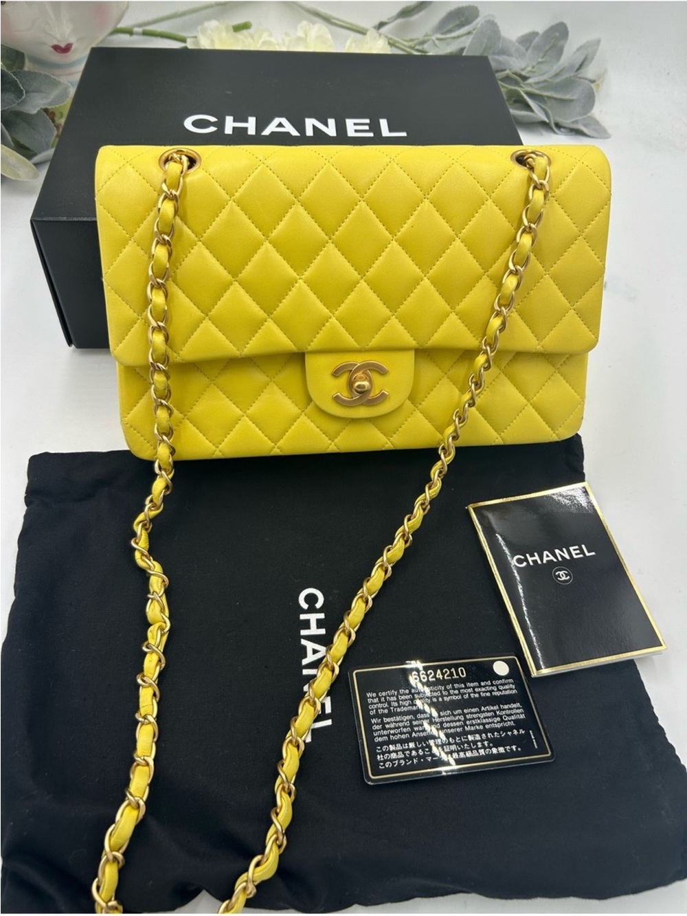 CHANEL CLASSIC QUILTED double flap bag . Yellow with gold hardware .
